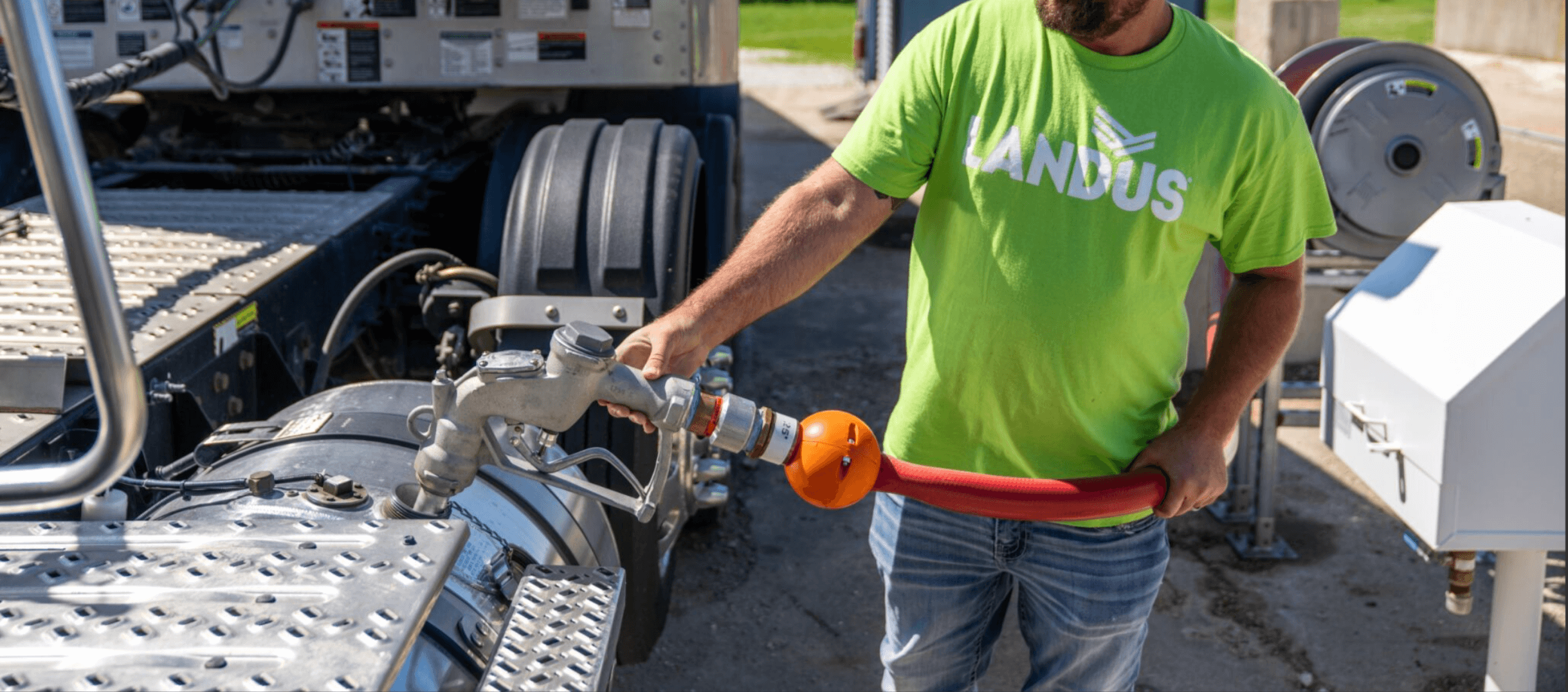 Cropped Landus employee filling with gas.png
